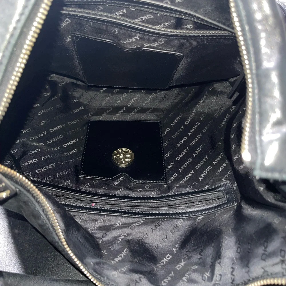 DKNY black leather shoulder bag with stud detailing.